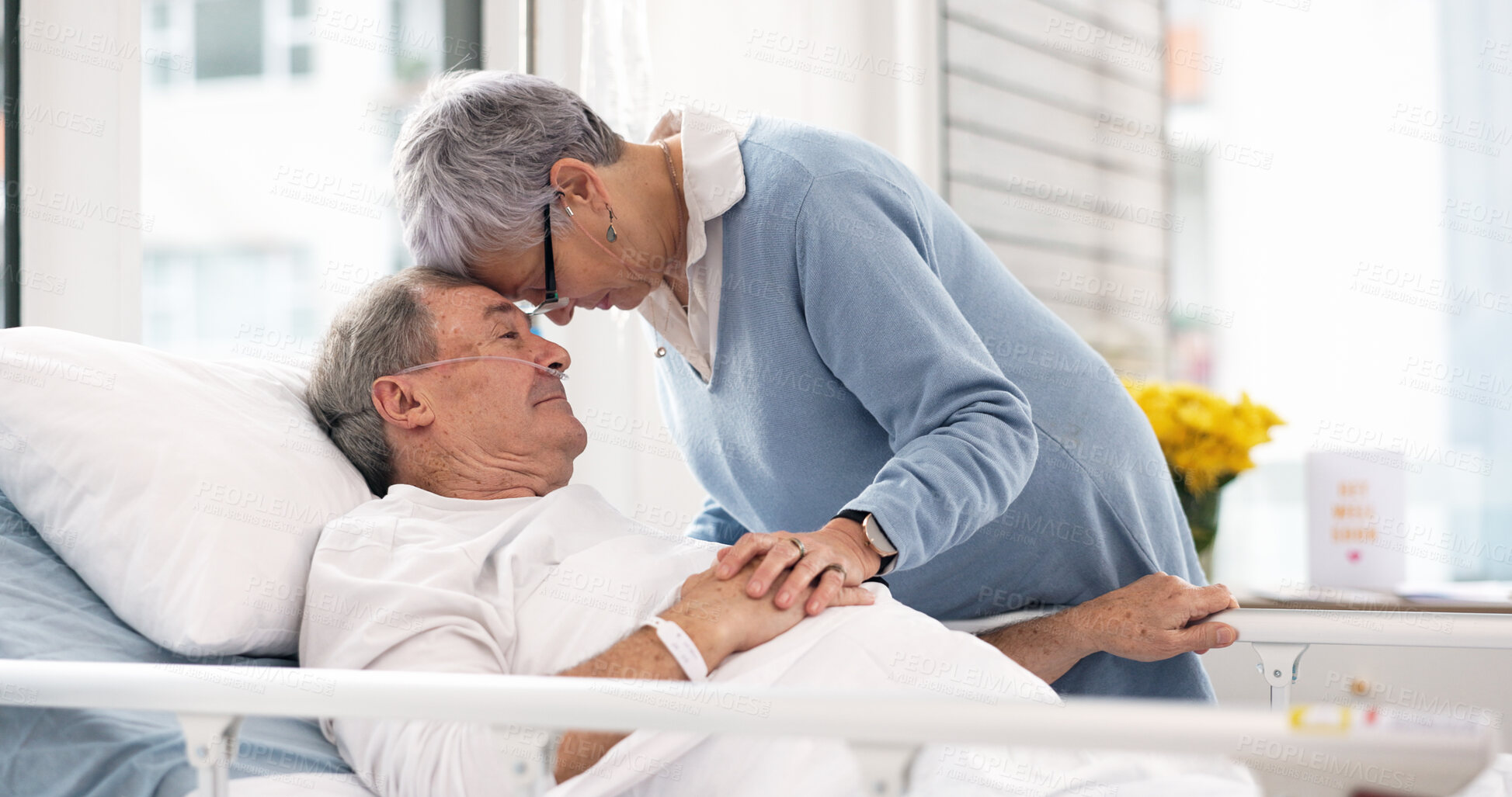 Buy stock photo Hospital, love or elderly couple, sick patient and affection for empathy, marriage bond and support for senior person. Retirement healthcare, forehead and man with medical problem, cancer or disease