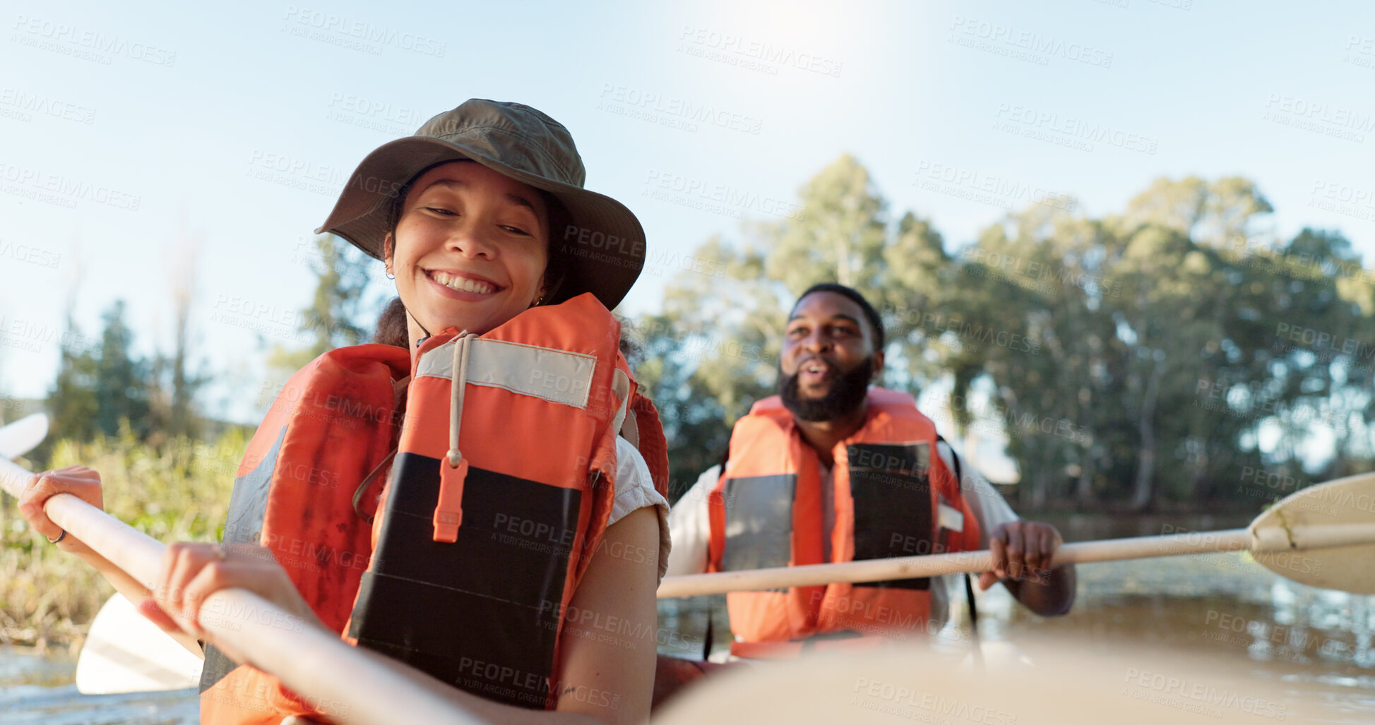 Buy stock photo Couple, kayak and rowing on a lake in nature for sports challenge, adventure or travel with a smile. Young man and woman friends together on boat and water for fitness, travel and holiday for freedom