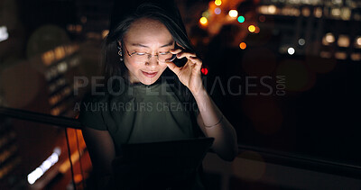 Glasses, tablet and Asian woman in night office, working late on project deadline or research. Tech, overtime and female employee with touchscreen reading email, report or proposal in dark workplace.