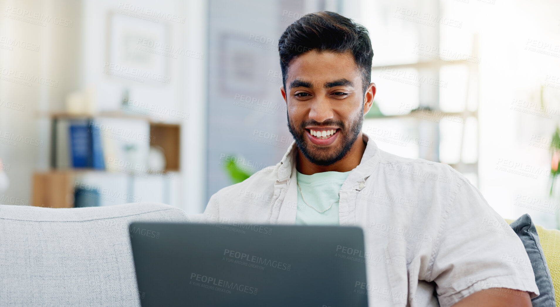 Buy stock photo Laptop, laughing and man on couch watching funny video, live streaming or reading post on social media. Happy person relaxing on sofa with computer, internet and wifi in his apartment or living room