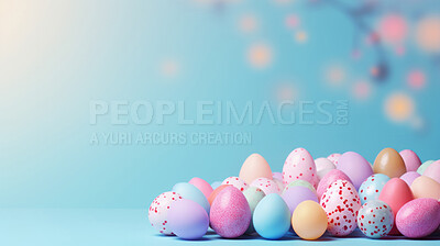 Many colorful easter eggs on white copysapce background. Chocolate candy in bokeh studio