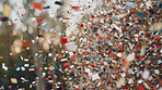 New Year celebration Festive background with falling confetti and bokeh lights.