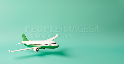 Airplane green copyspace background. Sustainable travel, zero emissions and biofuel concept.