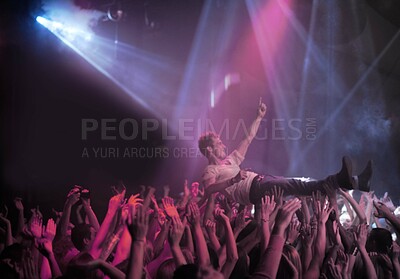 Buy stock photo A stage diver being carried across the audience at a rock concert