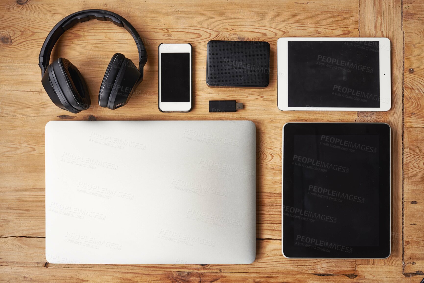 Buy stock photo High angle shot of wireless technology on a wooden table
