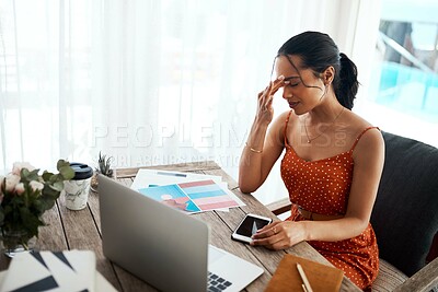 Buy stock photo Cropped shot of an attractive young businesswoman sitting in her home office alone and suffering from a headache
