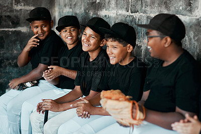 Buy stock photo Cropped shot of a group of young baseball players sitting together on the bench during a game