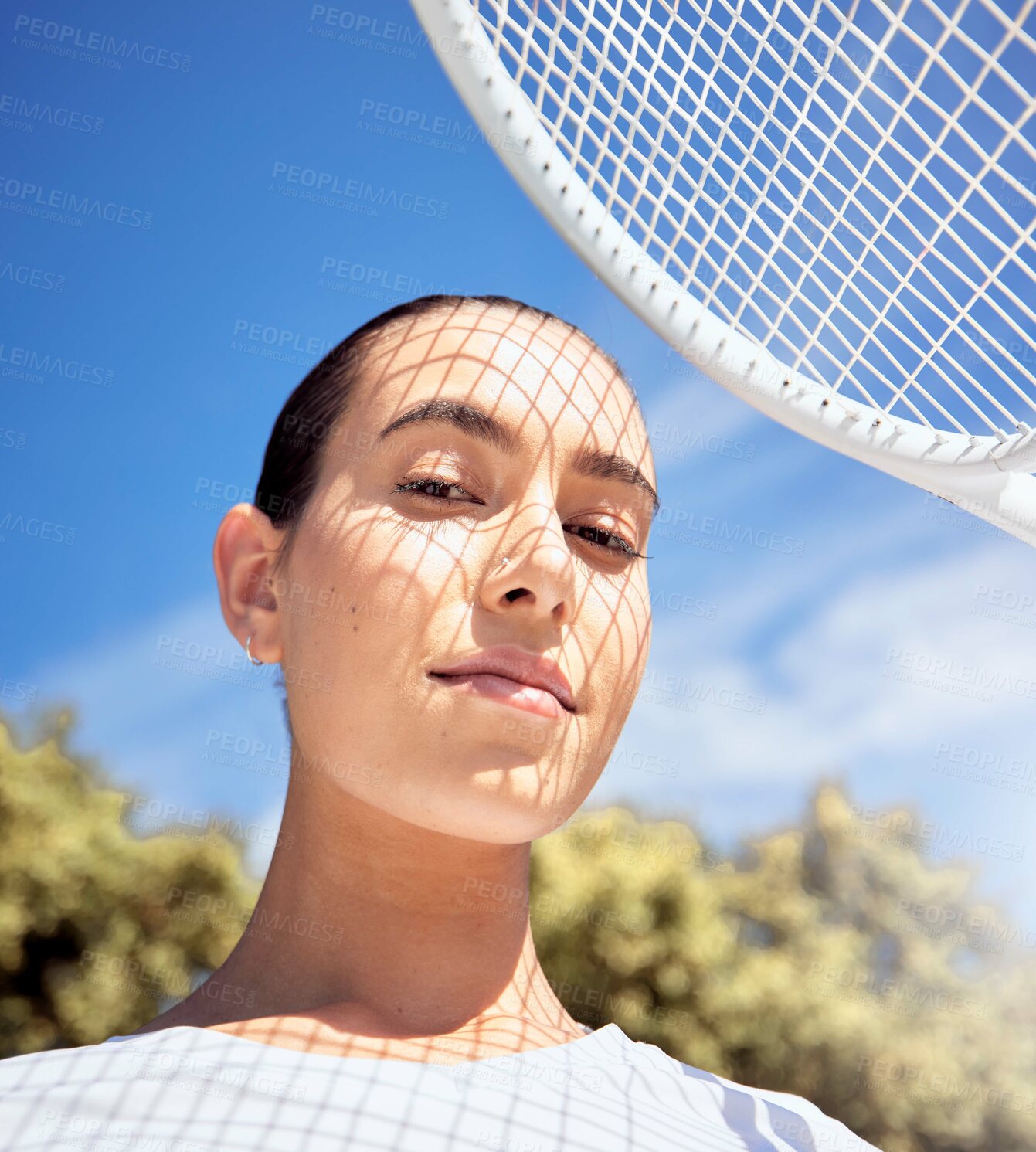 Buy stock photo Tennis racket, face and shadow on sports woman with motivation, wellness goals and winner mindset. Portrait of fitness person on court for exercise, workout and training for professional competition