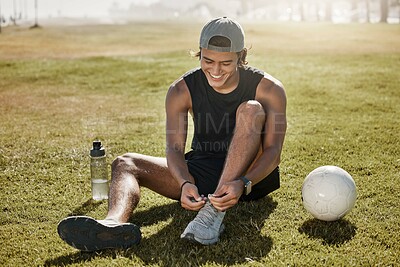 Buy stock photo Sports, football and man tie shoes lace before game, competition or fitness exercise on outdoor grass field. Wellness health, ball and athlete soccer player prepare for workout, training or cardio