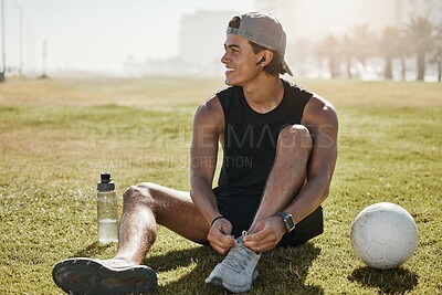 Buy stock photo Soccer field, sports gear and man on field, tying shoe laces for competition, game prepare or outdoor training. Gen z college or university person with sneakers for outdoor football practice on pitch