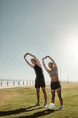 Buy stock photo Fitness, beach park and couple doing a stretching exercise as a warm up for football training. Sports, athletes and healthy man and woman doing workout for health, wellness and motivation for soccer.