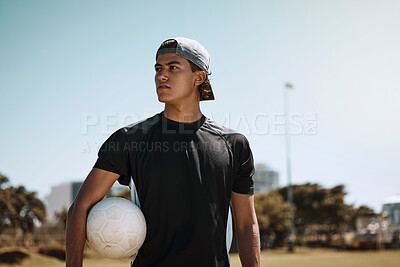 Buy stock photo Soccer, sports and training with a man athlete holding a ball on a grass pitch or field before a game. Fitness, football and exercise with a male player thinking about a match outside during summer