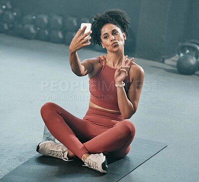 Buy stock photo Fitness, selfie and woman on a gym floor with phone, peace and hand sign before exercise routine. Workout, picture and peace gesture by black woman posing for photo after training, emoji and relax