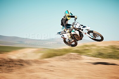 Buy stock photo Motorcross, air jump and offroad sports with motion blur, speed challenge or desert. Driver, cycling and stunt on dirt track, competition and motorbike performance on adventure course for fast action
