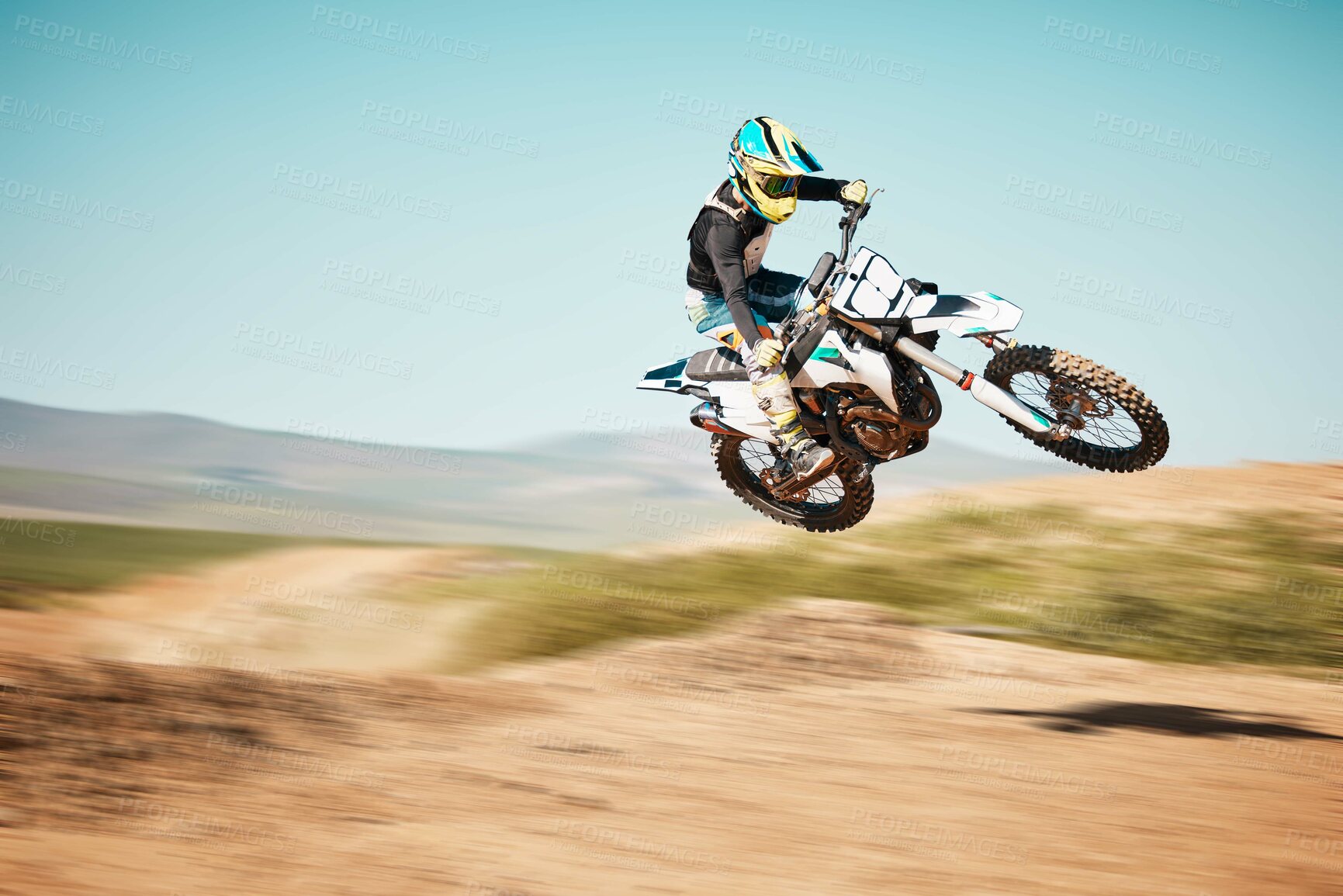 Buy stock photo Motorcross, air jump and offroad sports with motion blur, speed challenge or desert. Driver, cycling and stunt on dirt track, competition and motorbike performance on adventure course for fast action