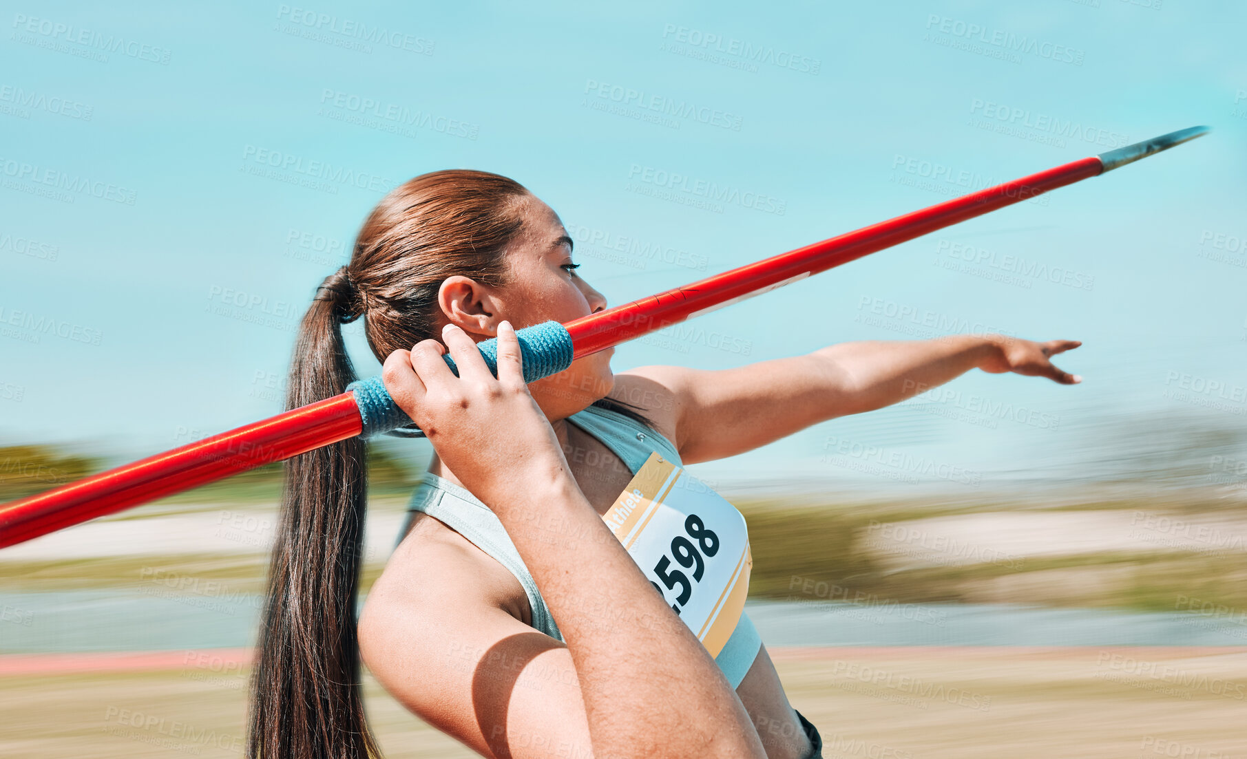 Buy stock photo Woman, javelin and athlete in sports competition, practice or training in fitness on stadium field. Active female person or athletic competitor throwing spear, poll or stick in distance