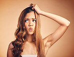 Hair, problem and upset woman with crisis and frustrated from salon treatment and Brazilian fail. Studio, brown background and model with damage from split ends and shock of bad and messy haircut 