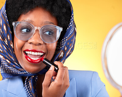 Buy stock photo Vintage, woman closeup and lipstick with mirror and retro clothing apply red makeup and confidence. Female model, studio and yellow background with cosmetics, fashion accessories and trendy glasses