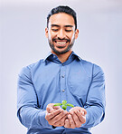 Corporate, sustainability and businessman happy with growth isolated in a studio white background with plant. Palm, startup and entrepreneur with soil and plant as an investment or climate change