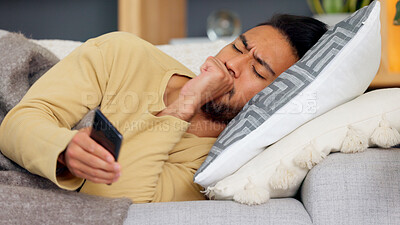 Buy stock photo Man, phone and cough on sofa in home living room, texting or communication with email notification. Guy, smartphone and sick with research for health, medicine or watch video on social media in house