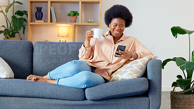 Buy stock photo Black woman, coffee and living room sofa with phone text and funny web meme at home. Happy, African female person relax and browsing social media on mobile app on the couch in the morning with tea