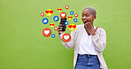 Surprise, black woman and phone icons, social media emojis and wow facial expression for online notification. Wow opinion vote, mockup and shocked user reading chat feedback on green background wall