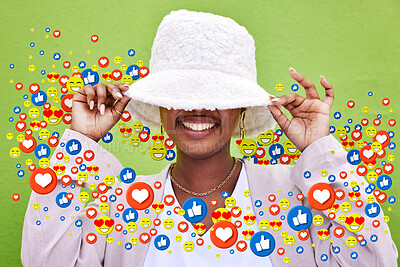 Buy stock photo Social media, smile and emoji icon of woman influencer for like or love reaction. Person hiding under hat for fan page, content creator app or communication notification overlay on green background
