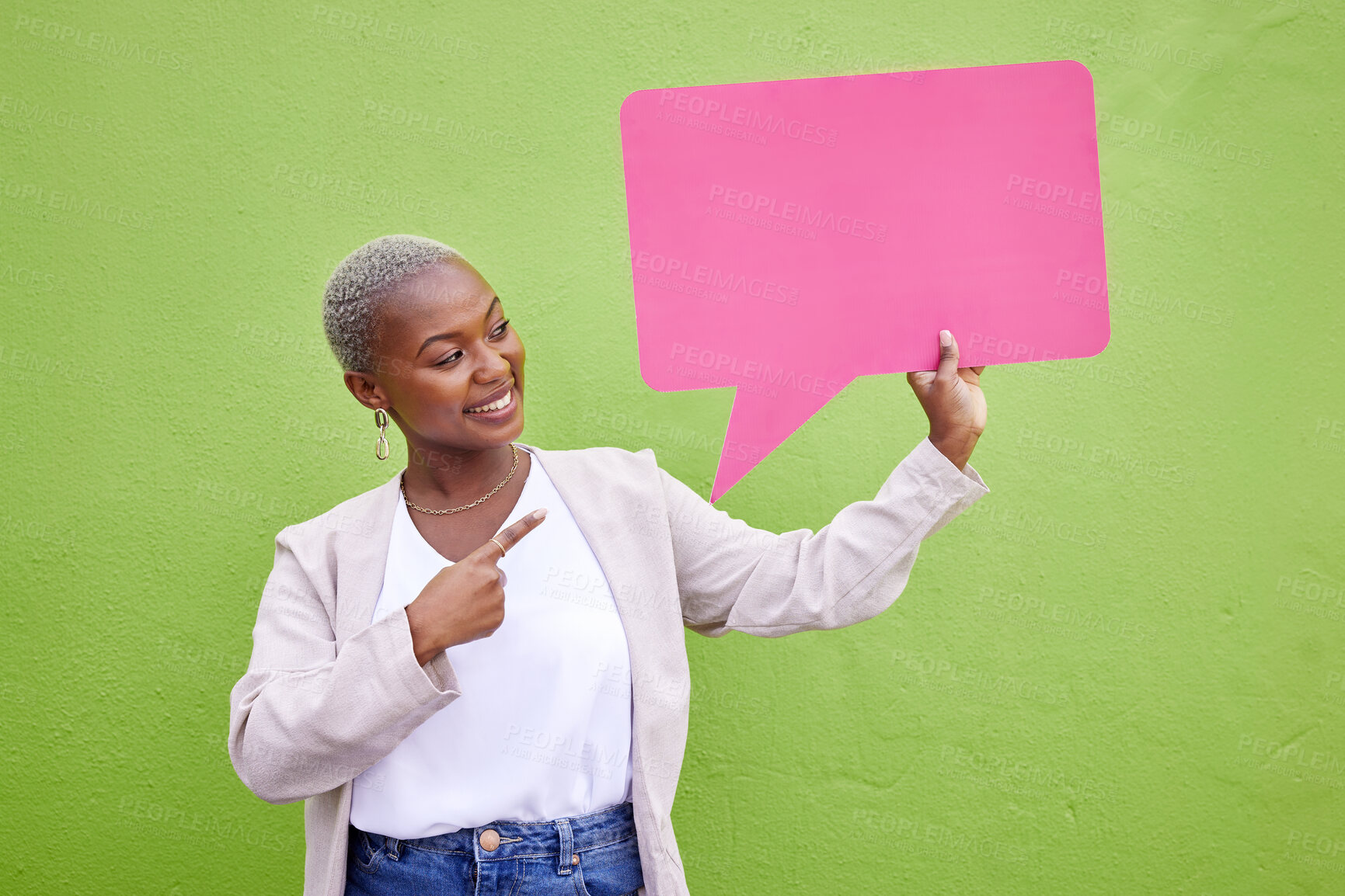 Buy stock photo Black woman, speech bubble and thinking for pointing, space or mockup with opinion by green wall background. African girl, billboard and paper poster for voice, vote and social network for feedback