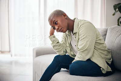 Buy stock photo Woman, thinking and anxiety on sofa for sad memory, mental health or depression of debt, crisis or fail. Frustrated, lonely and african person remember trauma of abuse, broken heart or stress at home