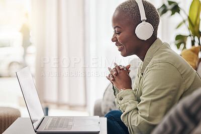 Buy stock photo Laptop, home or happy woman typing for communication, social media message or online dating. Headphones, laughing or funny African person streaming music or podcast on website or digital network