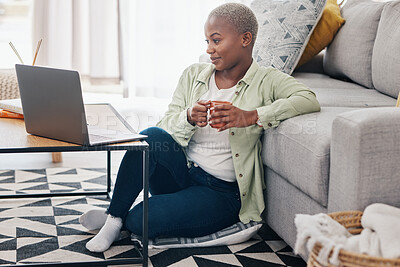 Buy stock photo Woman, coffee and watch movies on laptop, streaming multimedia or news show on floor of home. Happy african person relax with cup of tea, computer or social media subscription of online entertainment