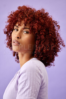 Buy stock photo Hair, portrait and woman in studio for beauty, wellness or texture treatment on purple background space. Natural haircare and face of female model with fun, red or afro, growth or profile dye results
