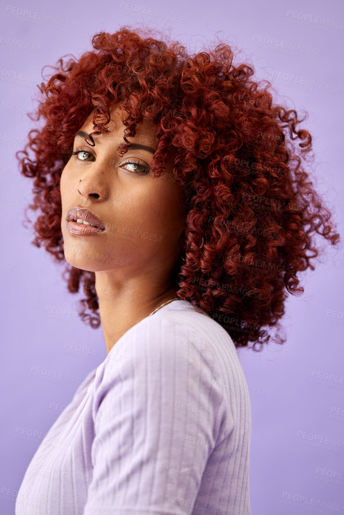 Buy stock photo Hair, portrait and woman in studio for beauty, wellness or texture treatment on purple background space. Natural haircare and face of female model with fun, red or afro, growth or profile dye results