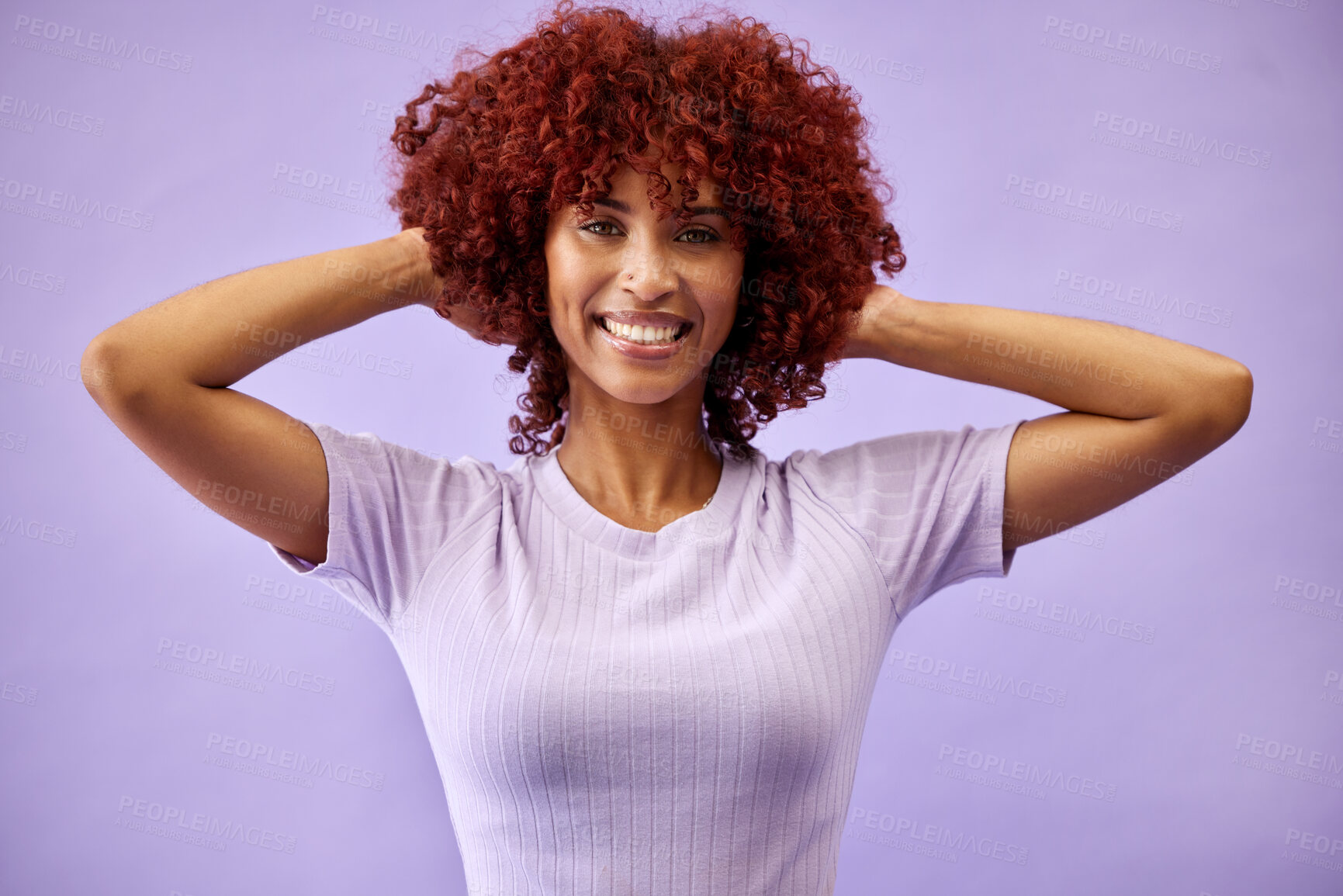 Buy stock photo Beauty, portrait and woman with natural hair in studio for cosmetics, fun or self care on purple background. Haircare, smile and face of lady model with red afro, dye and color texture satisfaction