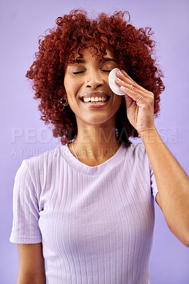 Buy stock photo Skincare, cotton and happy woman in studio for cleaning, wellness or cosmetic on purple background. Beauty, smile and lady model with facial swab for toner, cleanse or face pad for makeup application