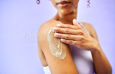 Buy stock photo Beauty studio, shoulder or person with cream application, skin treatment cosmetics or self care wellness. Sunscreen, body hydration or model dermatology creme, ointment or lotion on purple background