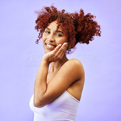 Buy stock photo Hand on face, natural beauty and woman, hair care and wellness with smile isolated on purple background. Dermatology, haircare and cosmetics, portrait with red curls and skin glow in a studio