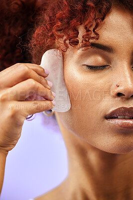 Buy stock photo Skincare, face and woman with gua sha in studio for facelift, wellness or anti aging on purple background. Beauty, crystal and lady model relax with facial, massage or lymphatic drainage for collagen