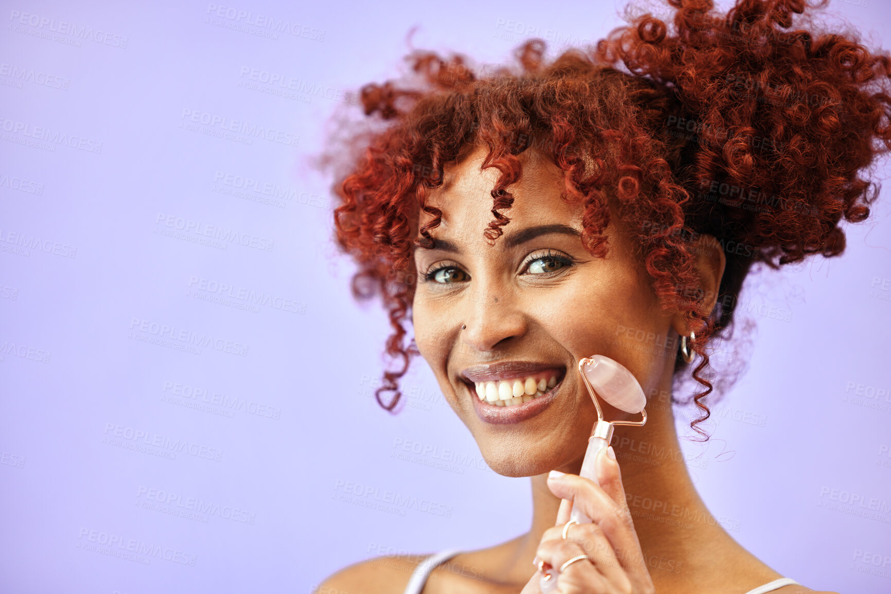 Buy stock photo Cosmetics, portrait and happy woman with rose quartz roller for massage, facial lymphatic drainage or skin routine. Stone product, mockup advertising space and studio girl on purple background