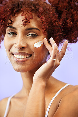 Buy stock photo Skincare, studio portrait or happy woman with cream, self care results or SPF sunscreen, lotion or skin hydration. Facial routine, face cosmetics or person with dermatology creme on purple background