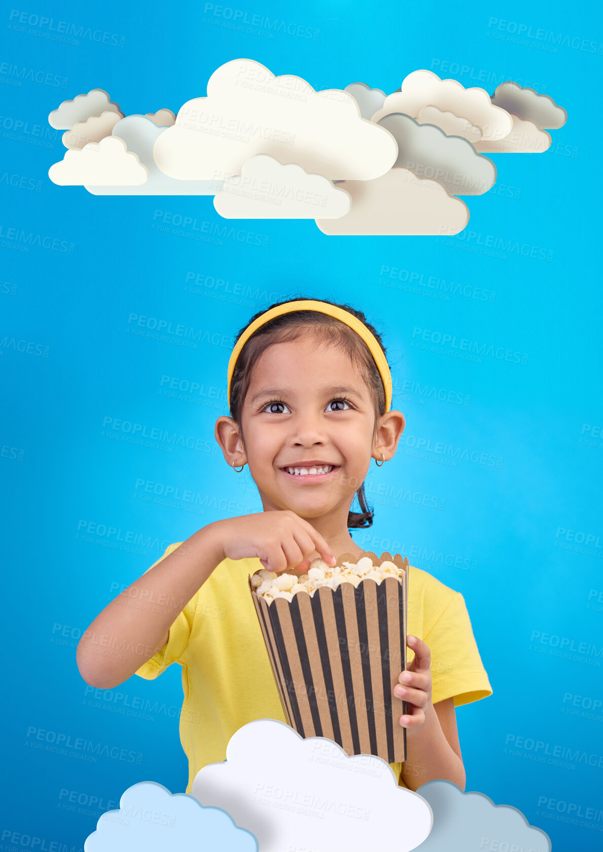 Buy stock photo Paper, cloud and girl child with popcorn in studio for cinema, fantasy or creative space on blue background. Kindergarten, lesson and kid with snack for movie, learning or creativity and television