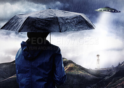 Buy stock photo Rain umbrella, man and ufo of alien outdoor on spaceship in science fiction mystery on countryside adventure. Flying saucer, back and person with extraterrestrial object for night abduction in storm