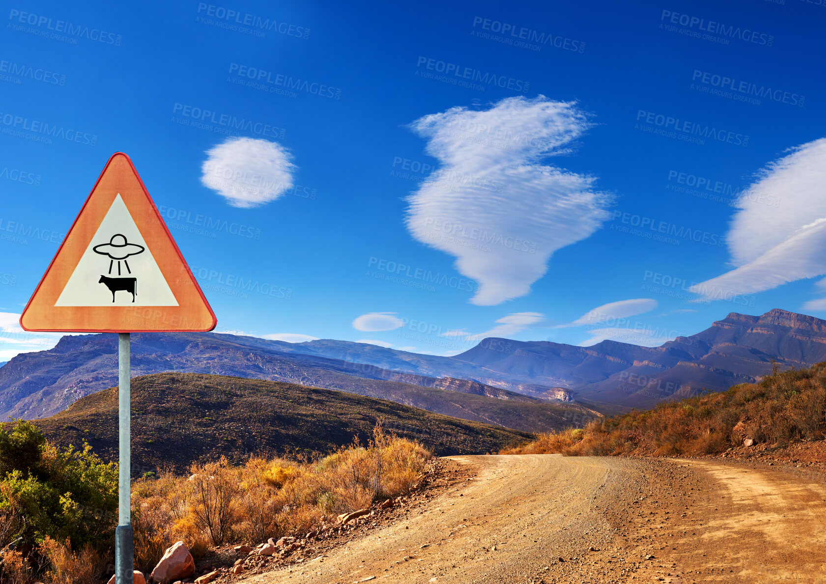 Buy stock photo Desert, sign and alien abduction in the mountains with a ufo warning along a dirt road on a blue sky. Nature, summer and and a route into area 51 with extraterrestrial signage on an empty landscape