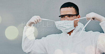 Buy stock photo PPE, face mask removal and man in safety suit of lab worker and healthcare professional in a hospital or clinic. Cleaning, bacteria protection for virus, pharmacy and wellness research with bokeh