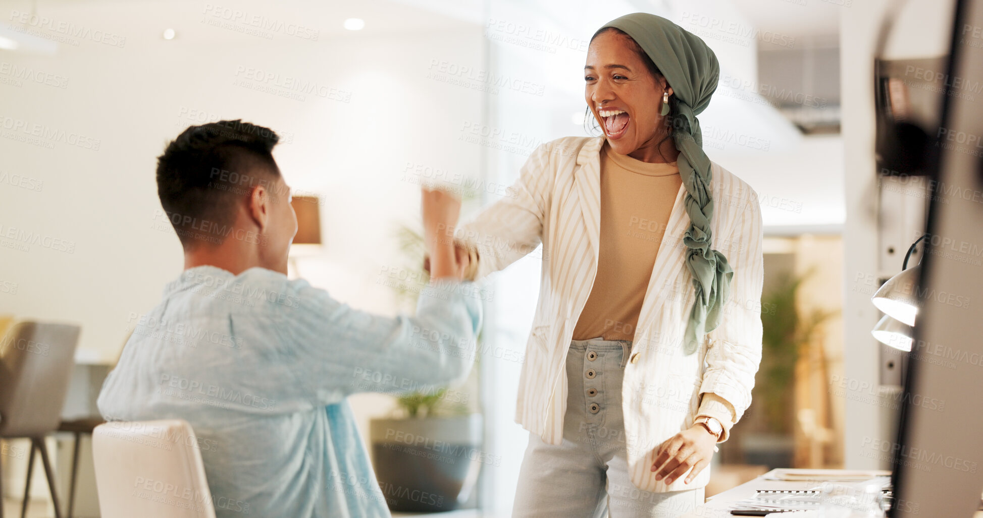 Buy stock photo Fist bump, excited and business people in an office for success, celebration or teamwork. Happy, collaboration and a Muslim employee with a man for a thank you, partnership or friends handshake