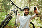 Man, bicycle and forest for selfie, smile and web for wellness, training and blog on adventure. Influencer guy, cycling and mountain bike for profile picture, memory or live streaming on social media