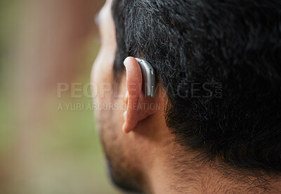 Buy stock photo Closeup of hearing aid, ear and man with disability from the back for medical support, listening and healthcare tech. Deaf patient, face and audiology implant to help volume, vibration or sound waves