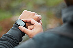 Hand, time and a man hiking in the forest closeup for freedom, travel or adventure outdoor in nature. Watch, fitness and recreation with a hiker in the woods to discover or explore the wilderness