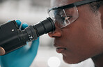 Microscope, black man and healthcare with research, medical and dna test with biotechnology. African person, science and researcher with laboratory equipment, check sample and vaccine with analytics