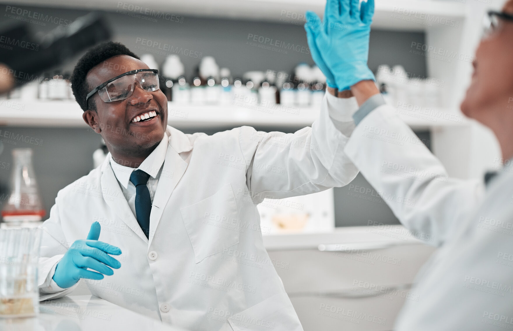 Buy stock photo Scientist man, woman and high five in laboratory, smile or partnership for goals, results or innovation with ppe. African science expert, teamwork and congratulations for success in medical research